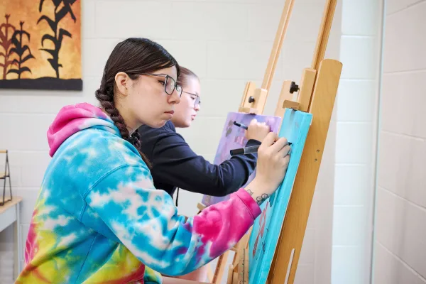 Young women are drawing, having an art class