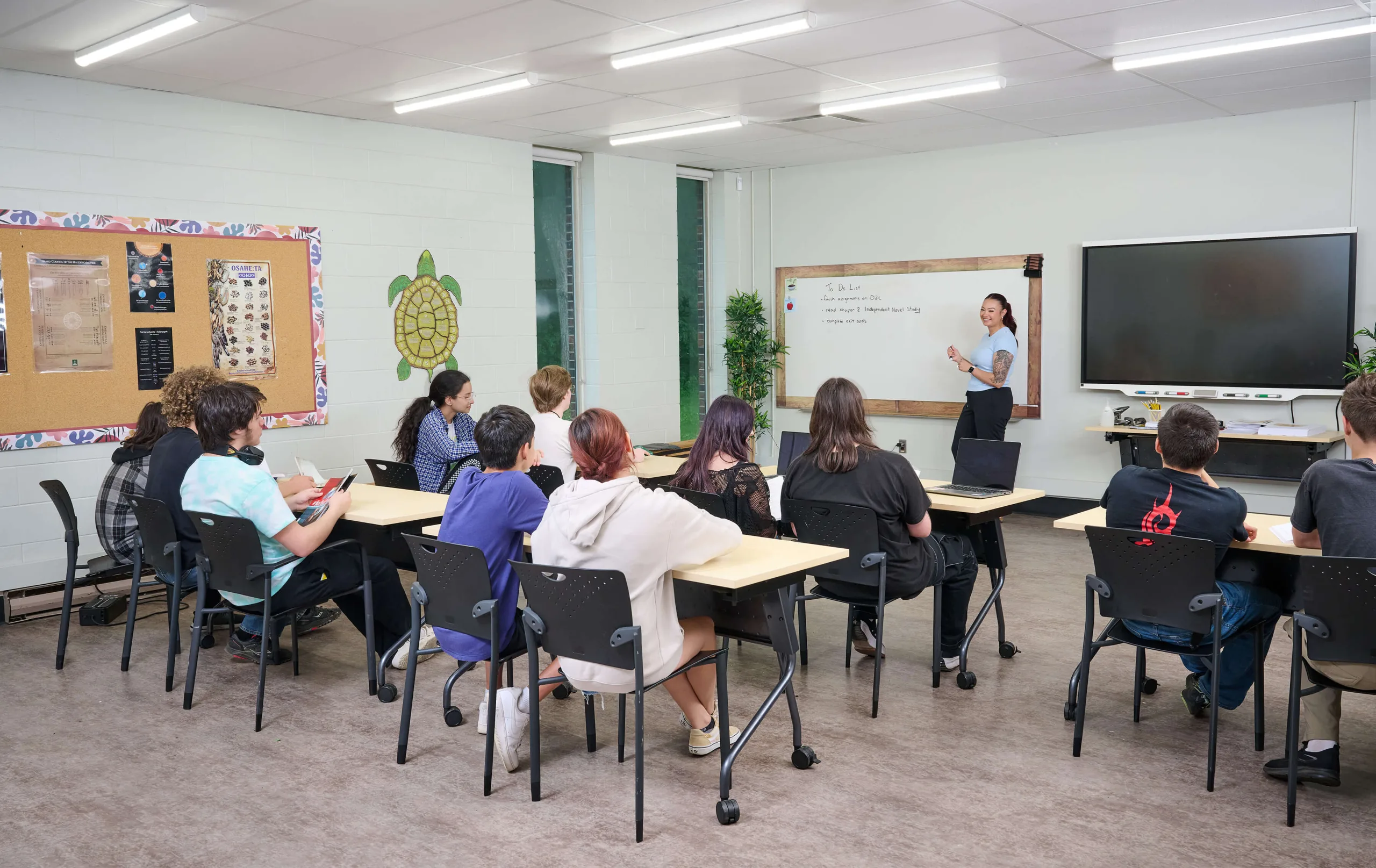 Students in a classroom, having a lesson