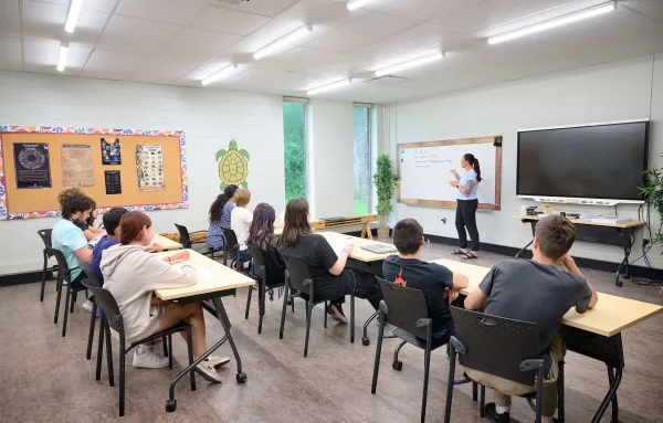 Students in a classroom, having a lesson
