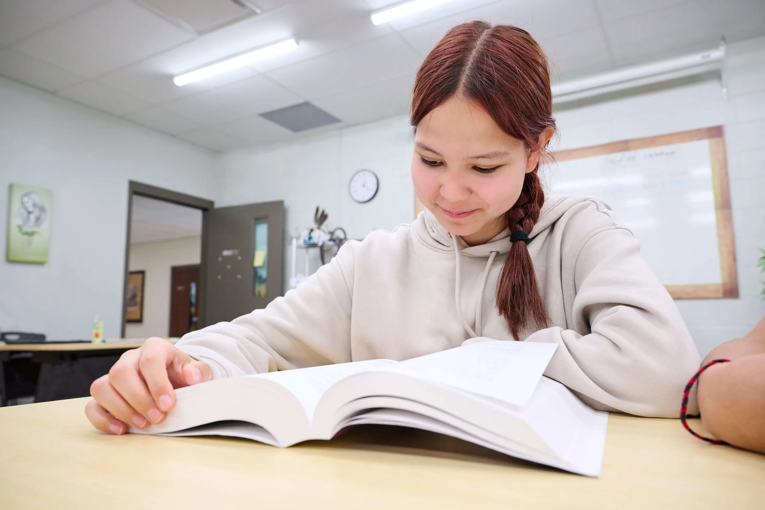 Young women is reading a book.