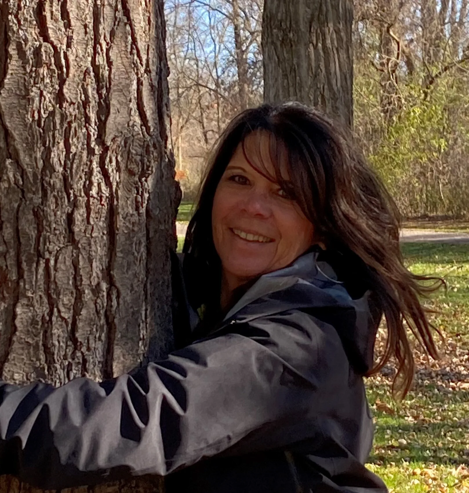 social counsellor suzie miller hugging a tree